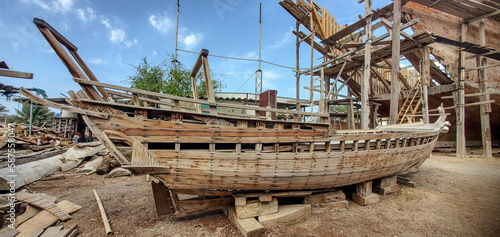 The exterior of a giant traditional dhow Al Ghanja in the shipbuilding factory of Sur, Ash Sharqiyah, Oman