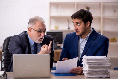 Two male colleagues working in the office