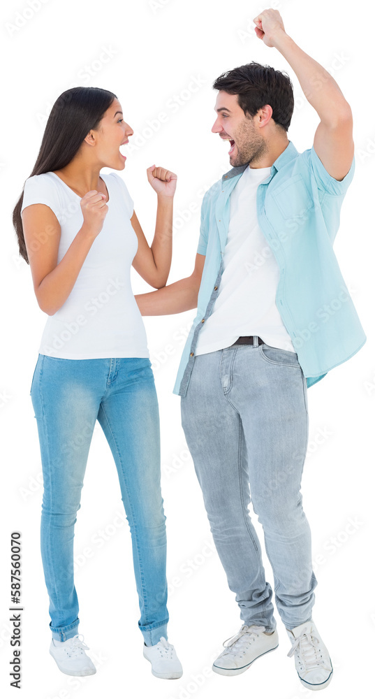 Happy casual couple cheering together Happy casual couple cheering together