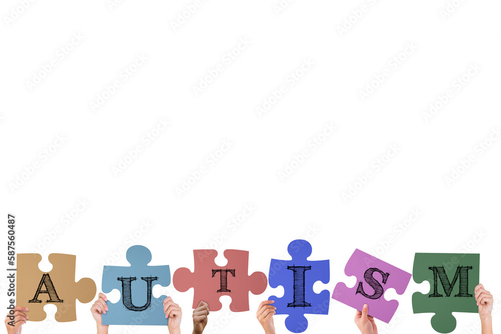 Hands holding up autism jigsaw pieces Hands holding up autism jigsaw pieces