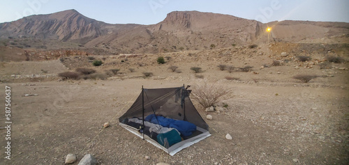 Camping in the arid Eastern Hajar Mountains, Wadi Bani Khalid, Oman photo