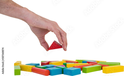 Cropped image of person arranging blocks