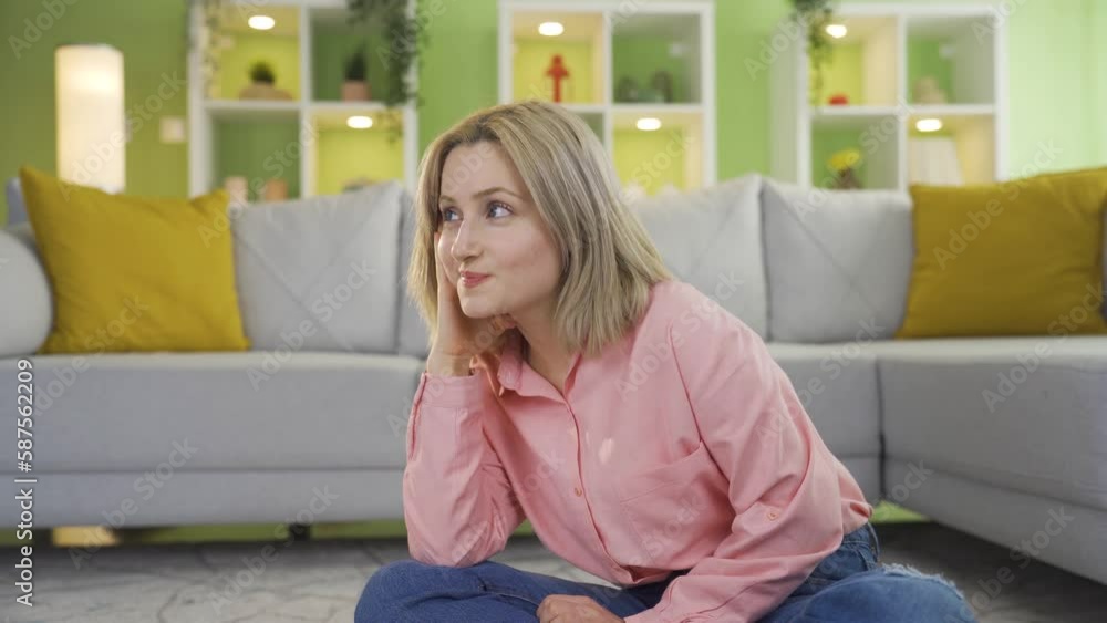 Young girl at home daydreaming.
Young girl sitting alone on the carpet at home is daydreaming. He laughs to himself.
Young girl at home daydreaming.
Young girl sitting alone on the carpet at home is daydreaming. He laughs to himself.