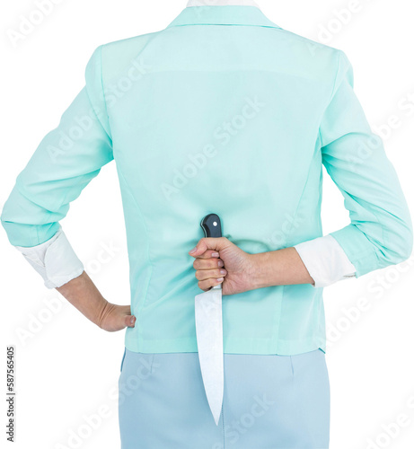 Rear view of businesswoman hiding knife