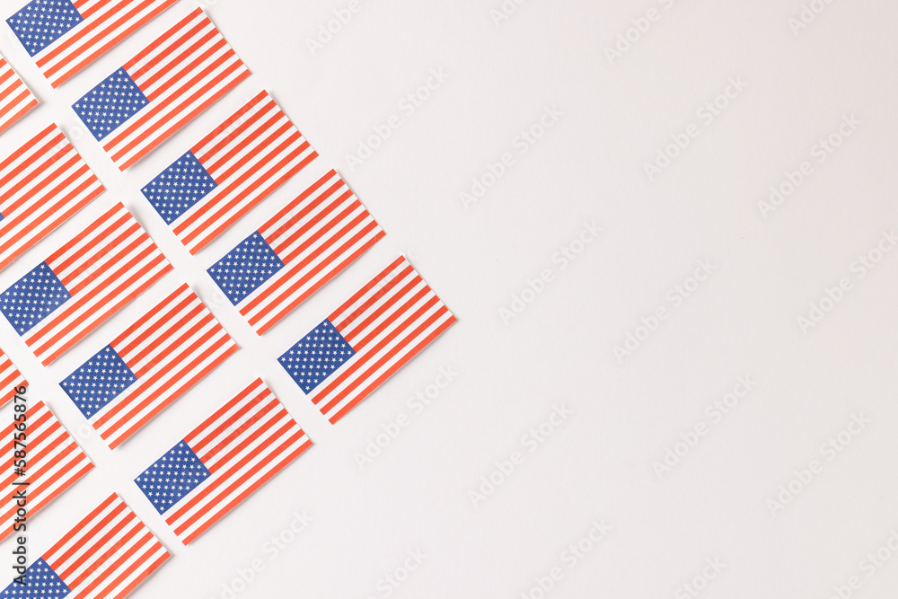 High angle view of rows of flags of united states of america with copy space on white background High angle view of rows of flags of united states of america with copy space on white background