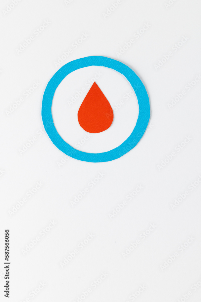 Fototapeta premium Blood drop in blue ring on white background with copy space