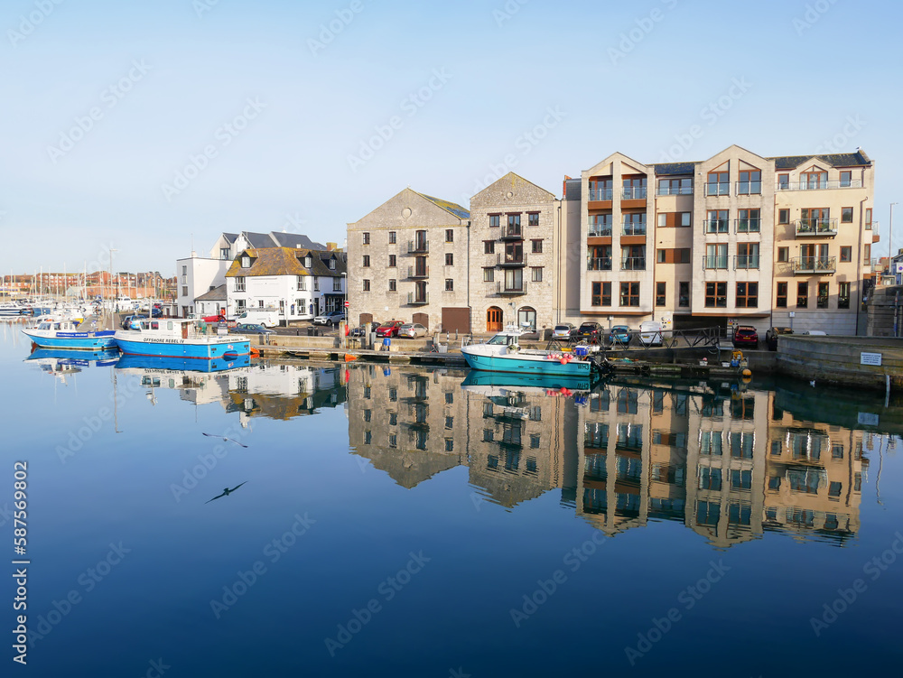 Boats in the old town of Weymouth Harbour and Weymouth Marina in Dorset, England, UK Boats in the old town of Weymouth Harbour and Weymouth Marina in Dorset, England, UK
