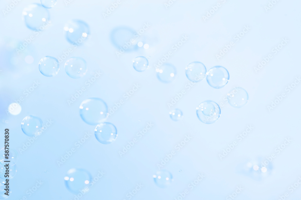 Beautiful Transparent Blue Soap Bubbles. Blurred Abstract White Background. Soap Sud Bubbles Water.