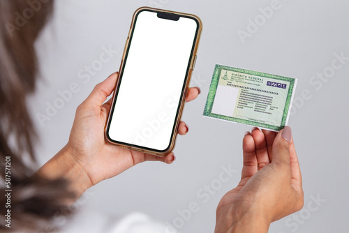 Brazilian identity card, RG, document. Smartphone, white screen for advertisements. photo