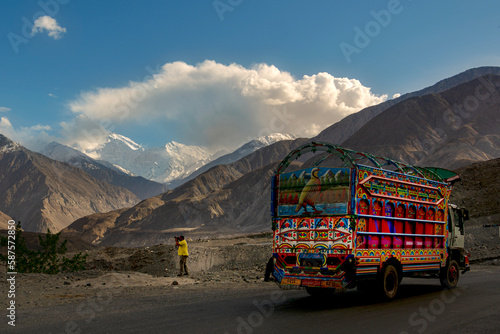 truck on the mountain road , beautiful decorated Turks on the Karakorum highway  in gilgit baltistan , truck art in Pakistan  photo