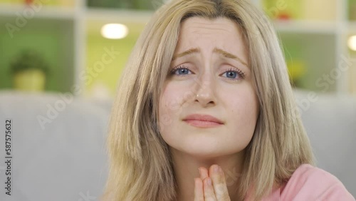 Young woman begging looking at camera.
Young woman looking at camera and pleading about a topic.
