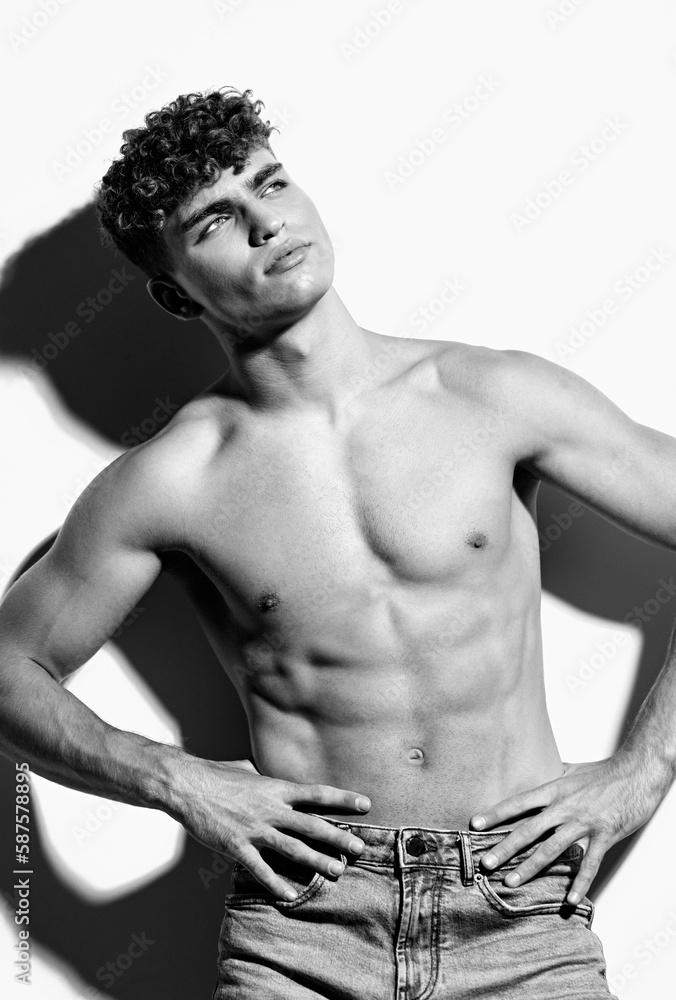 Fototapeta premium man fashion healthy beautiful sport strong beauty torso jeans white bodybuilder fitness black and white