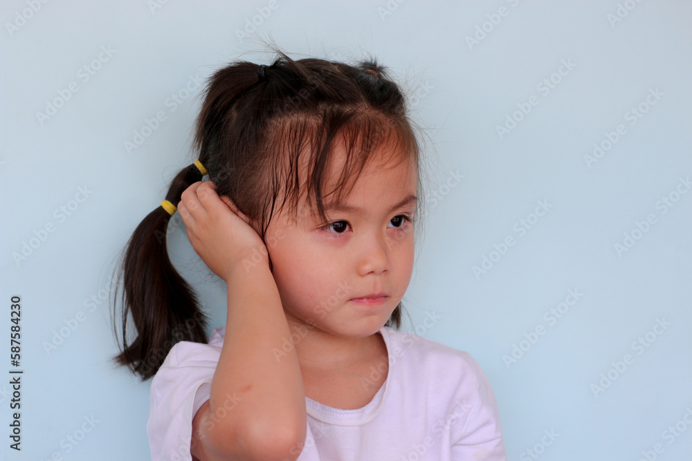 The girl gestures with her hands covering her ears. The girl gestures with her hands covering her ears.