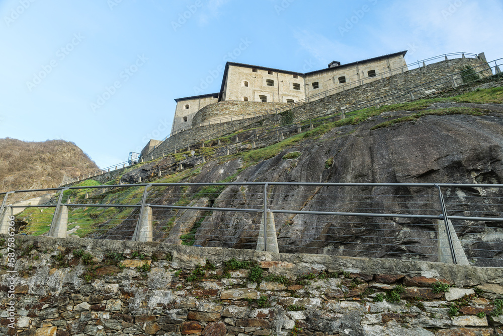 Bard, Italy. View from below of the Forte di Bard, an ancient military fortress located at the entrance to the Aosta Valley, a few kilometers from the border with Piedmont. 2023-03-25.