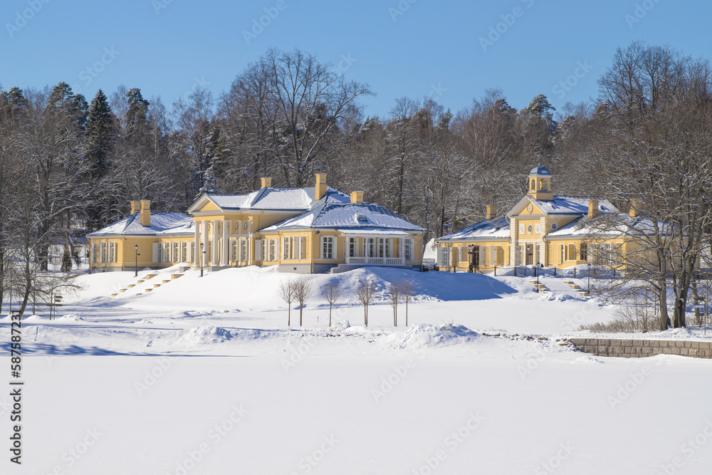 The main building and the library outhouse of the old Monrepos estate on a sunny March day. Vyborg, Leningrad region. Russia