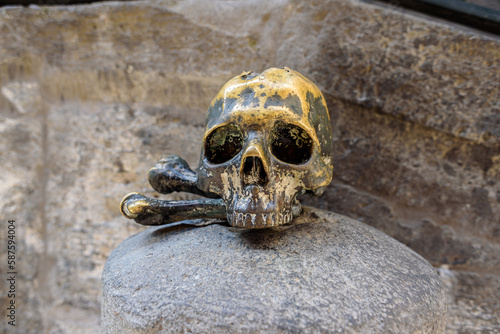 Naples, Italy. Brass skull outside the Church of Santa Maria delle anime del Purgatorio ad Arco, in Via dei Tribunali, in the historic center of the city. 2022-08-20.