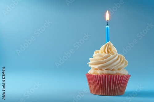 birthday cupcake with candle, birthday cupcake with light blue candle on light blue background