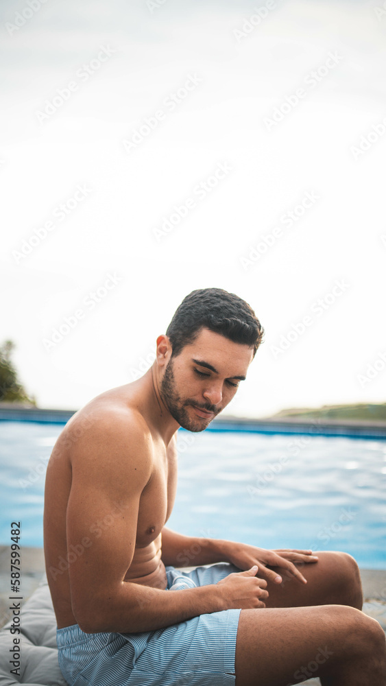 boy relaxing un the pool