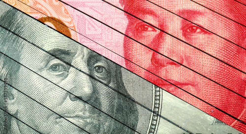 100 United States Dollar (USD) and 100 Renminbi (RMB, CNY) banknotes isolated together. Outline background of China and USA economic and trade. Currency competition concept image.