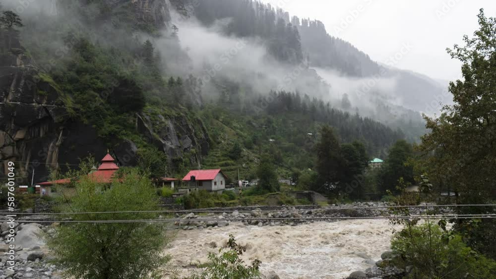 4K time lapse of monsoon clouds moving in mountain valley and rain downpour with high flow in river Bias at Manali, Himachal Pradesh, India. Misty mountains. Travel and holidays concept. 4K time lapse of monsoon clouds moving in mountain valley and rain downpour with high flow in river Bias at Manali, Himachal Pradesh, India. Misty mountains. Travel and holidays concept.