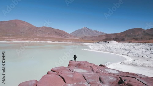 Person running at Piedras Rojas Red Rocks Lagoon in San Pedro de Atacama Chile photo