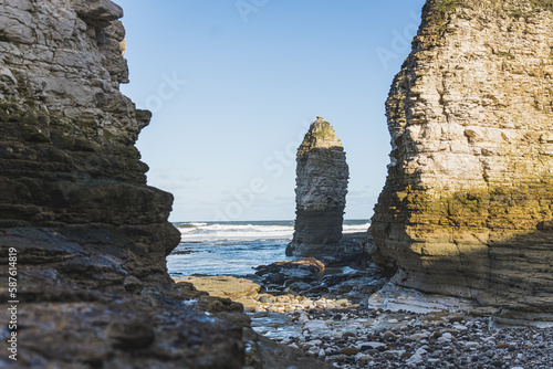 The chalk headland and sheer white cliffs of Flamborough Head on the beach of the North Sea, Yorkshire. High quality photo