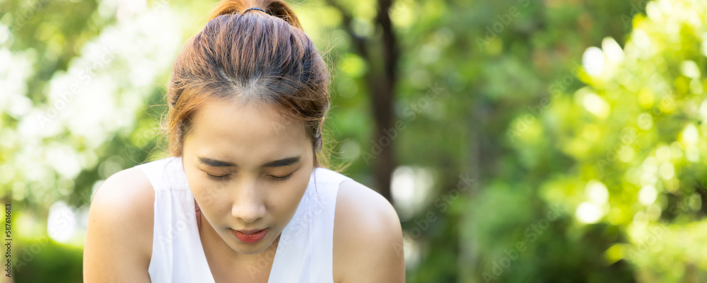 Tired fitness woman panting after hard working out, header crop Tired fitness woman panting after hard working out, header crop