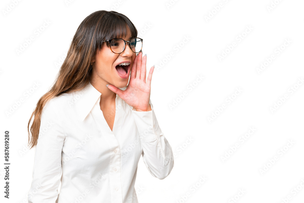 Young caucasian woman over isolated chroma key background shouting with mouth wide open to the side