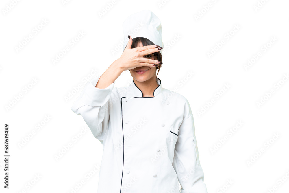 Young caucasian chef woman over isolated chroma key background covering eyes by hands and smiling Young caucasian chef woman over isolated chroma key background covering eyes by hands and smiling