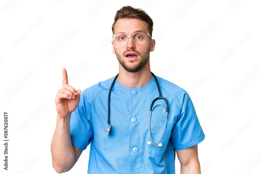 Young nurse man over isolated chroma key background thinking an idea pointing the finger up Young nurse man over isolated chroma key background thinking an idea pointing the finger up