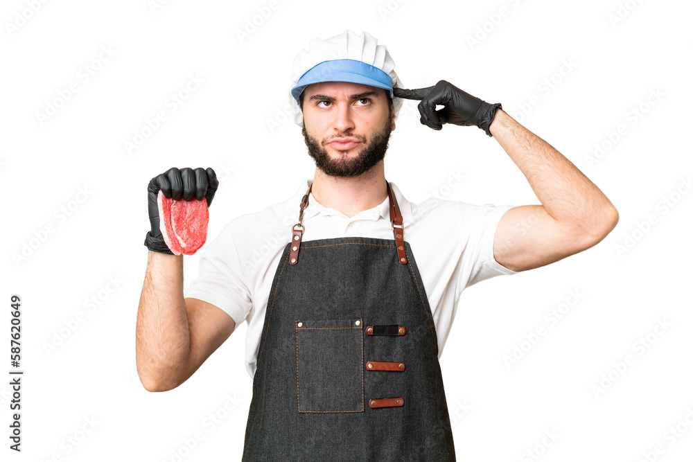 Butcher man wearing an apron and serving fresh cut meat over isolated chroma key background having doubts and thinking Butcher man wearing an apron and serving fresh cut meat over isolated chroma key background having doubts and thinking