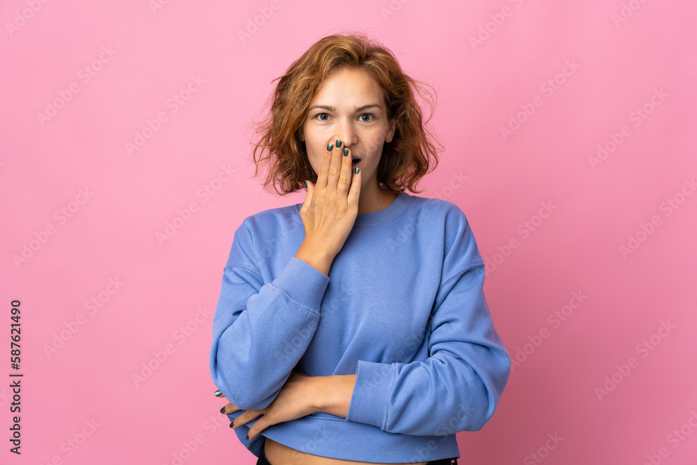 Young Georgian woman isolated on pink background surprised and shocked while looking right Young Georgian woman isolated on pink background surprised and shocked while looking right