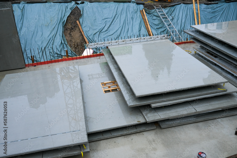Construction site, concrete foundation of big house in rain Construction site, concrete foundation of big house in rain