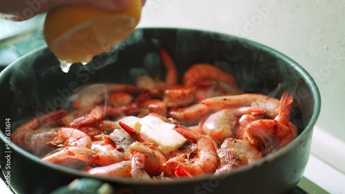 Close-up of shrimps being fried in oil pan Tasty seafood cooking time