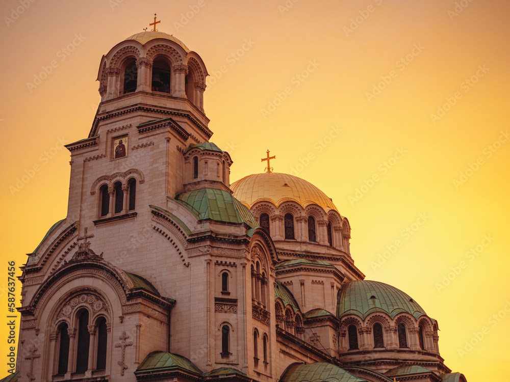 Christianity and Christian Easter concept. Golden domes of Christian church, Cathedral of Alexander Nevsky in Sofia at dawn isolated in the golden hour