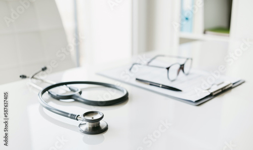 Doctor office desk, work place of physician, therapist, practitioner, health worker or medical professional. Health care, medicine, medical insurance concept