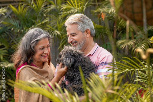 Senior couple loving with dogy puppy. concept about pets and animals. photo