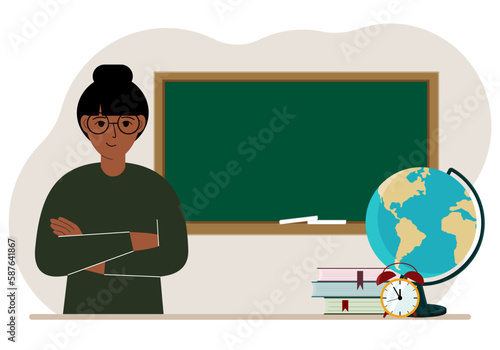 Female teacher near the blackboard. The concept of education, teaching, teacher's day.