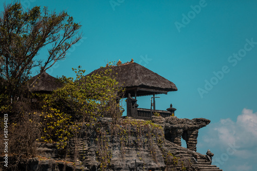 Smal Hindu Enjung Galuh Temple next to Tanah Lot located on natural cliff cave, Bali, Indonesia