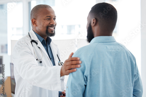 Doctor, black man and touch shoulder of patient for support, comfort and empathy in hospital. Healthcare, consultation and happy medical professional talking, good news or kindness with mature person