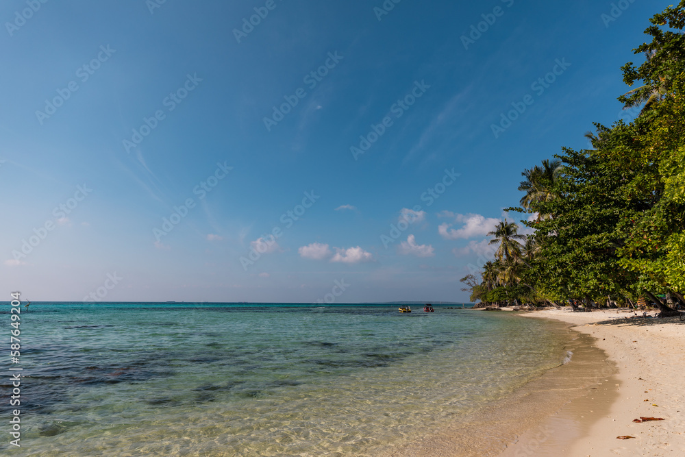 Tropical landscape of Indonesian island Karimunjava with jungle and turquoise lagoon in the distance. 