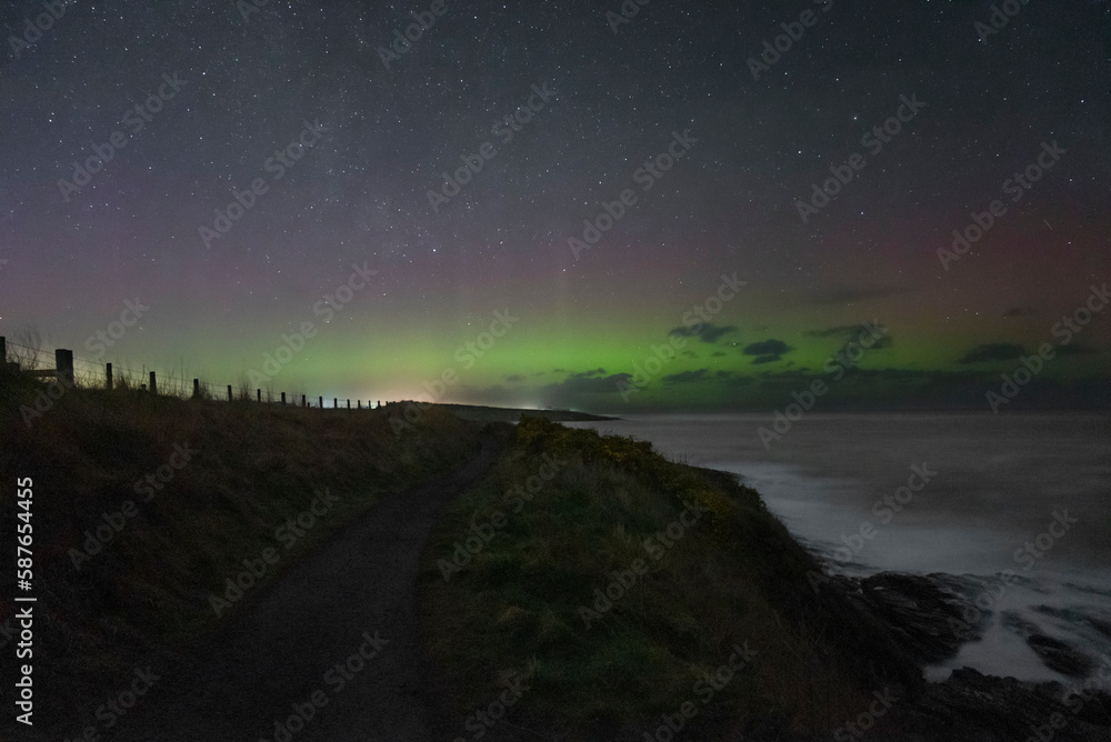 Aurora Borealis breaking through the sky at the coast Aurora Borealis breaking through the sky at the coast