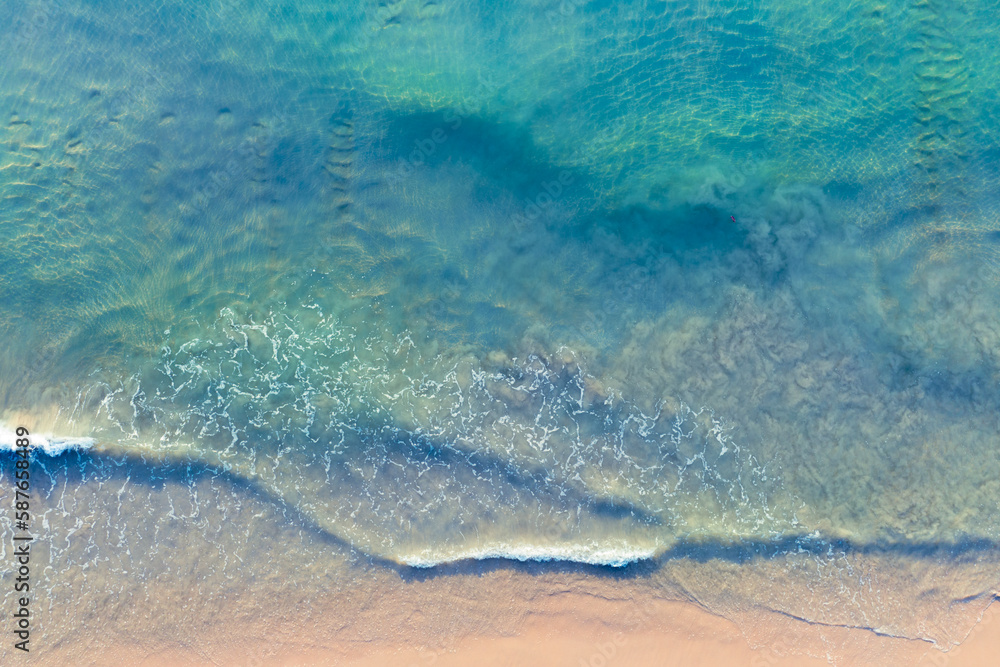 (Top view) Aerial view drone over beach sea. Beautiful sea waves. Beach sand and amazing sea. Summer sunset seascape. Phuket Thailand Beach. Water texture. Top view of the fantastic natural sunsets