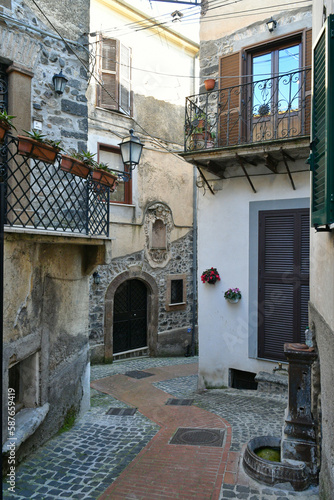 Fototapeta Naklejka Na Ścianę i Meble -  A narrow street among the old houses of Pofi, a medieval town in the Lazio state, province of Frosinone in Italy.