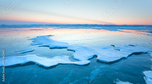 Fototapeta Naklejka Na Ścianę i Meble -  Frozen lake Baikal in winter season at amazing sunset, Olkhon island in Siberia, Russia