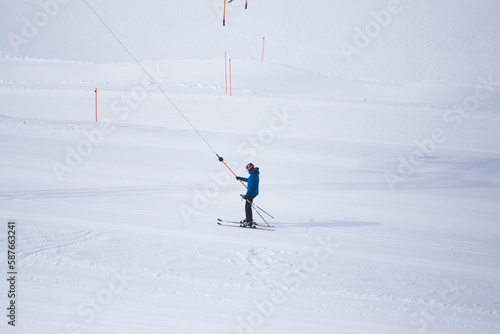 A man rides a ski lift