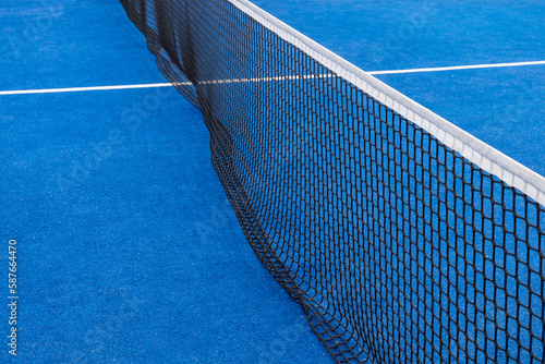 view of the net of a blue paddle tennis court © Vic