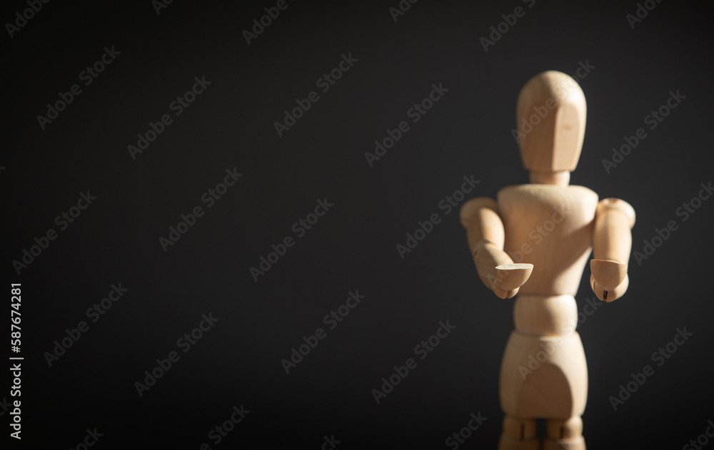 Wooden human figure on the grey background. Wooden human figure on the grey background.