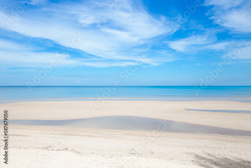 The Sunny beach and turquoise sea with clear sky background