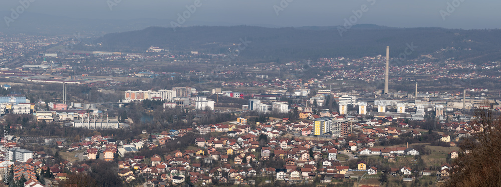 Panoramic view of Banja Luka city, distant hills fade in haze, air pollution in city